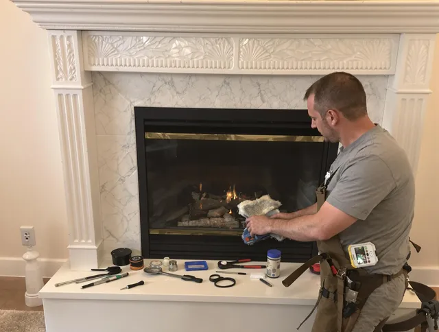 North Castle Chimney Sweep performing fireplace maintenance in North Castle, NY
